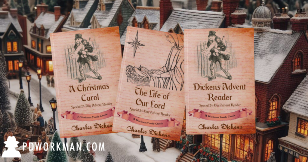 dickens books in front of christmas village