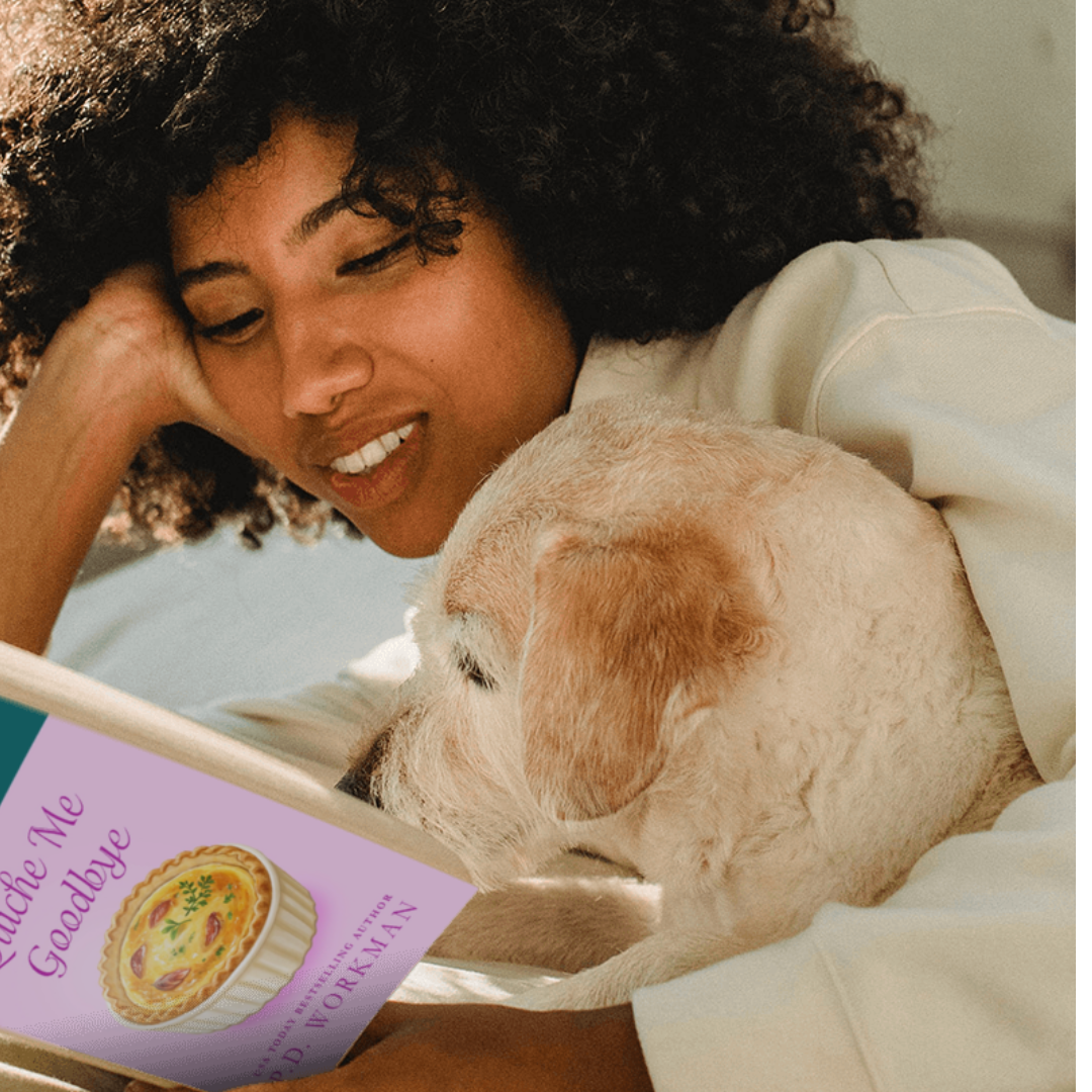 woman cuddled with her dog and a copy of Quiche Me Goodbye