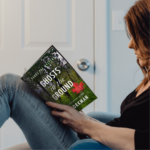 woman reading ghosts on the ground a police procedural mystery by p.d. workman
