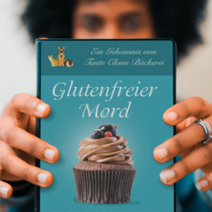 Close-up of a person’s hands holding a teal book cover with a cupcake image and the title 'Glutenfreier Mord'.