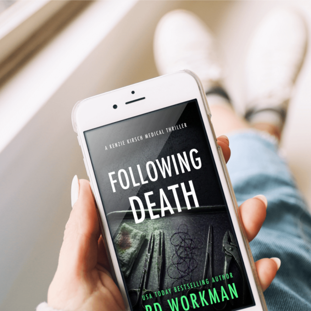 person holding phone with cover for Following Death a Kenzie Kirsch Medical Thriller